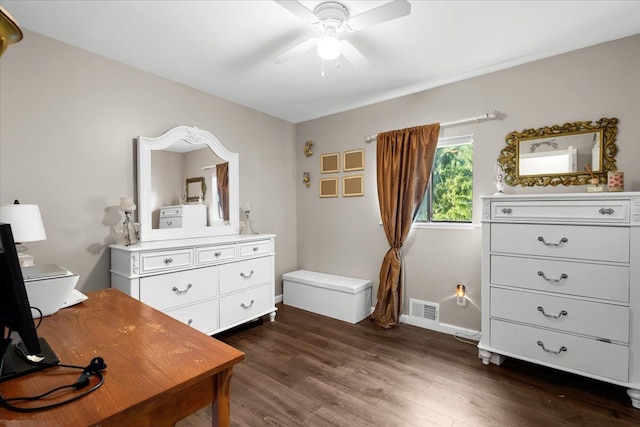 interior space with ceiling fan and dark hardwood / wood-style flooring