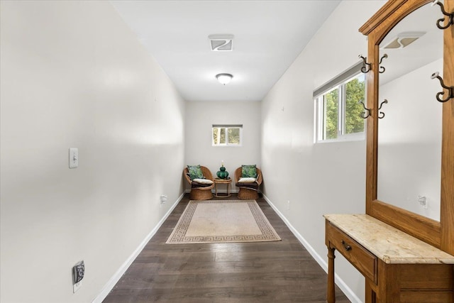 corridor featuring dark hardwood / wood-style flooring