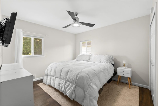 bedroom featuring ceiling fan and dark hardwood / wood-style flooring