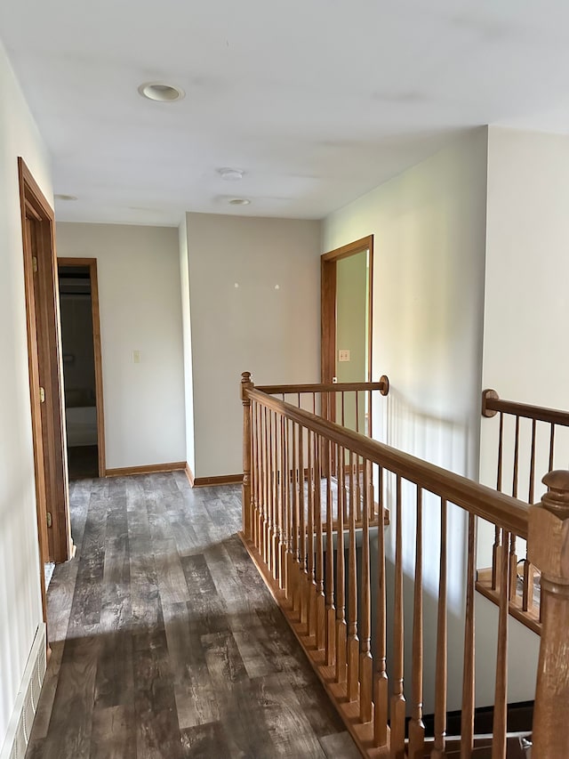 hallway with dark hardwood / wood-style floors