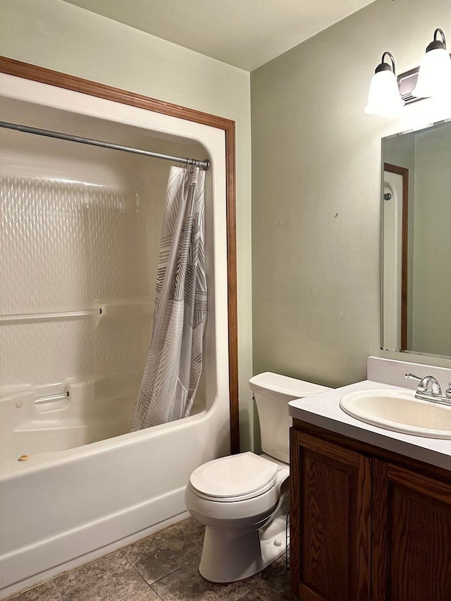 full bathroom featuring toilet, vanity, tile patterned floors, and shower / bathtub combination with curtain