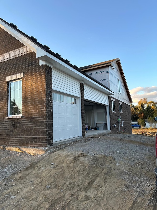 view of property exterior with a garage