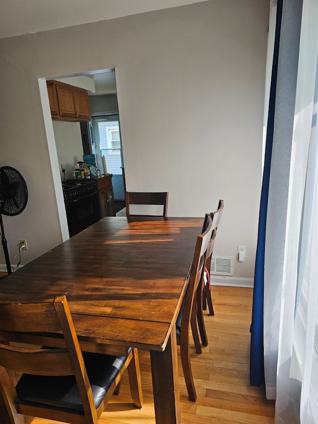 dining space featuring light hardwood / wood-style flooring