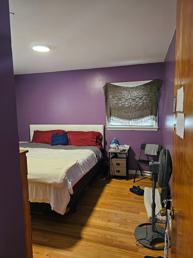 bedroom with wood-type flooring