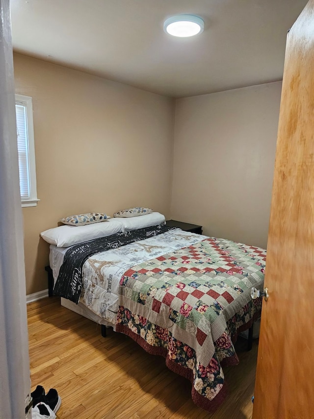 bedroom with wood-type flooring