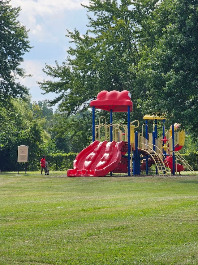 view of jungle gym with a lawn