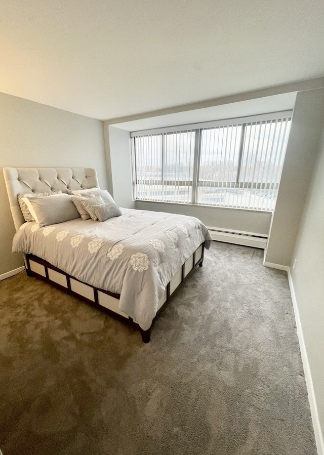 carpeted bedroom featuring a baseboard radiator