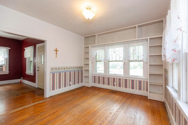 empty room featuring wood-type flooring