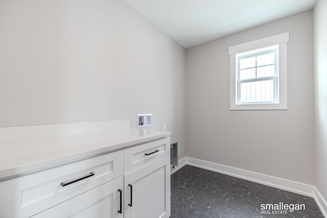 laundry area with cabinets and hookup for a washing machine