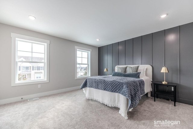 bedroom with light colored carpet