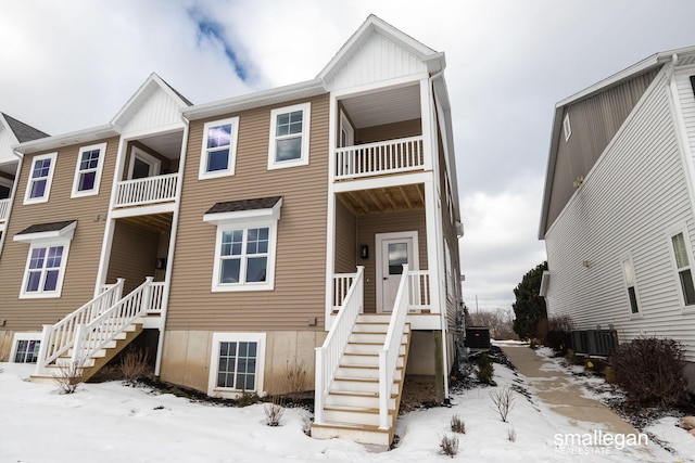 townhome / multi-family property with stairs and central AC unit