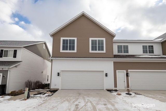 view of front of home with a garage and driveway