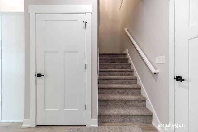 stairway featuring baseboards