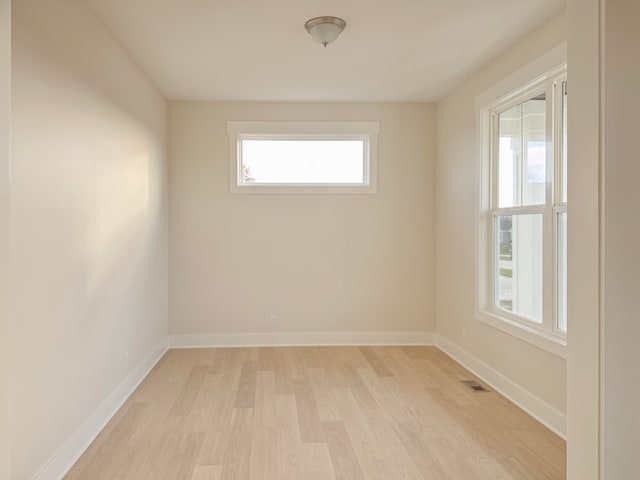 spare room with light hardwood / wood-style floors