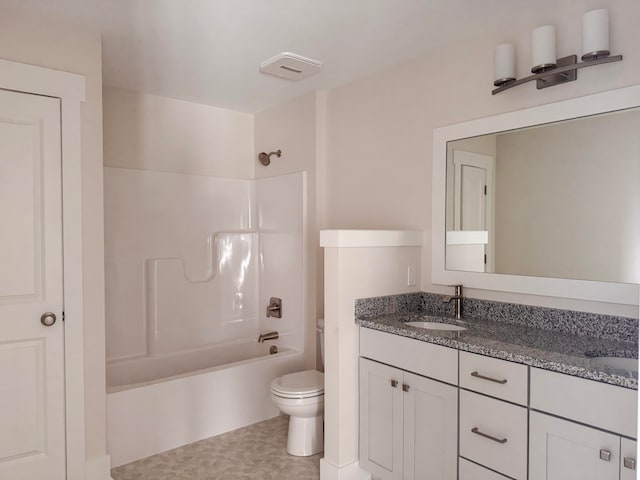 full bathroom with toilet, vanity, and shower / washtub combination