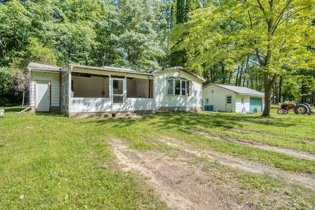 view of front of property featuring central AC and a front lawn