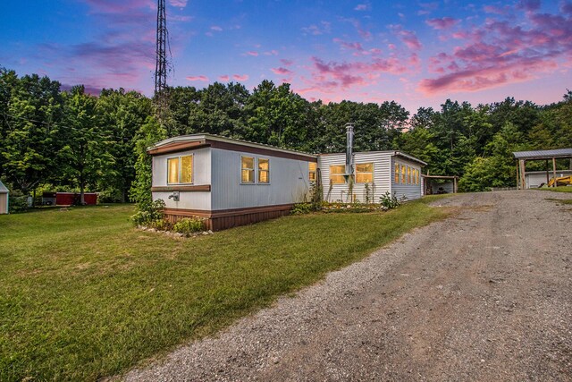 6662 Lorne Dr, Pentwater, MI 49449 - manufactured / mobile home with driveway and a lawn