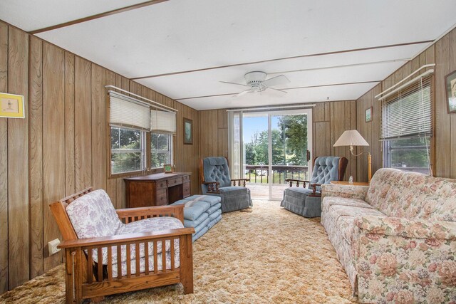 6662 Lorne Dr, Pentwater, MI 49449 - living area with wood walls and a ceiling fan