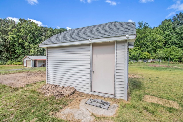 view of outdoor structure with a yard