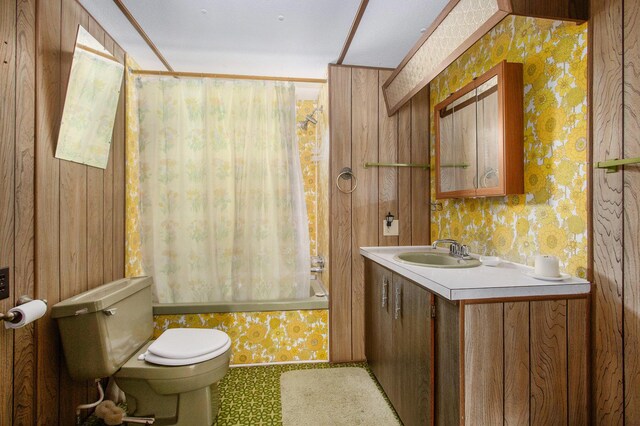 6662 Lorne Dr, Pentwater, MI 49449 - bathroom with wallpapered walls, toilet, shower / tub combo with curtain, and vanity