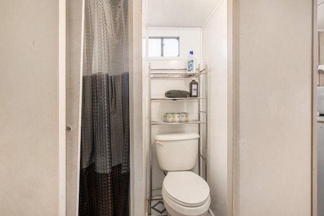 bathroom featuring toilet