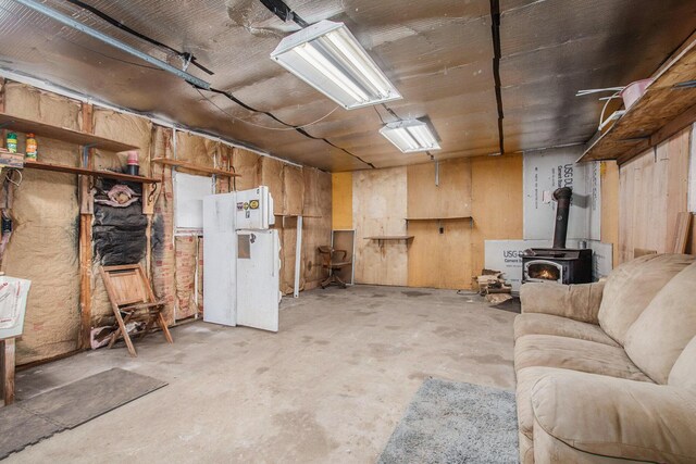 6662 Lorne Dr, Pentwater, MI 49449 - basement with a wood stove