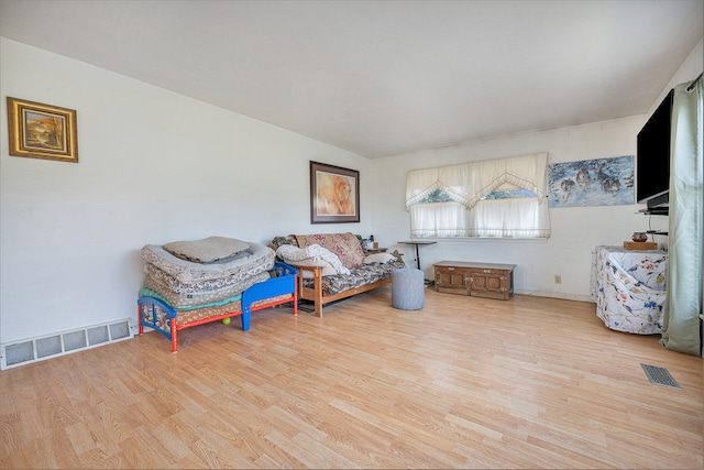 sitting room with light wood-type flooring