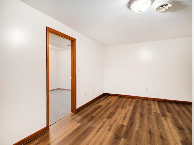 empty room featuring dark hardwood / wood-style floors