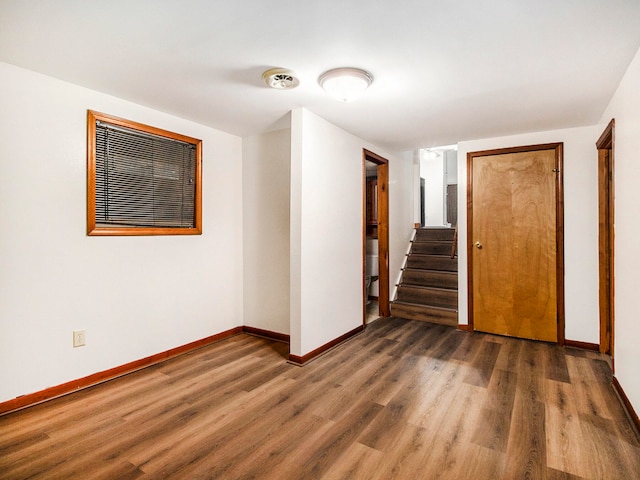 spare room featuring dark hardwood / wood-style flooring