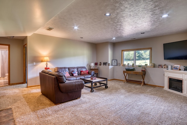 carpeted living room with a textured ceiling