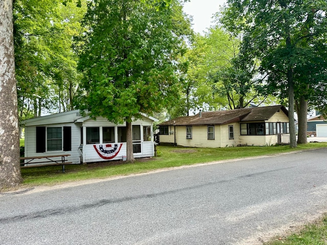 ranch-style house with a front lawn