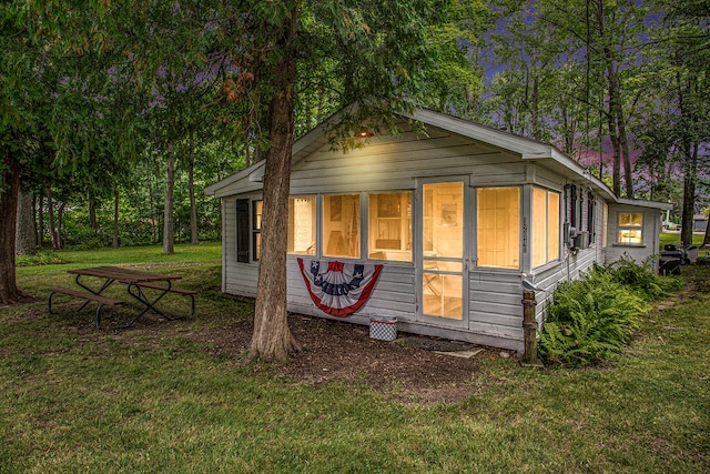 view of home's exterior with a yard