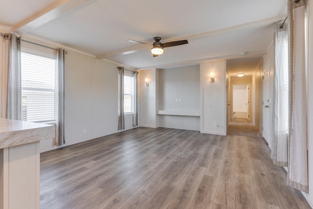 unfurnished living room with ceiling fan and light hardwood / wood-style floors