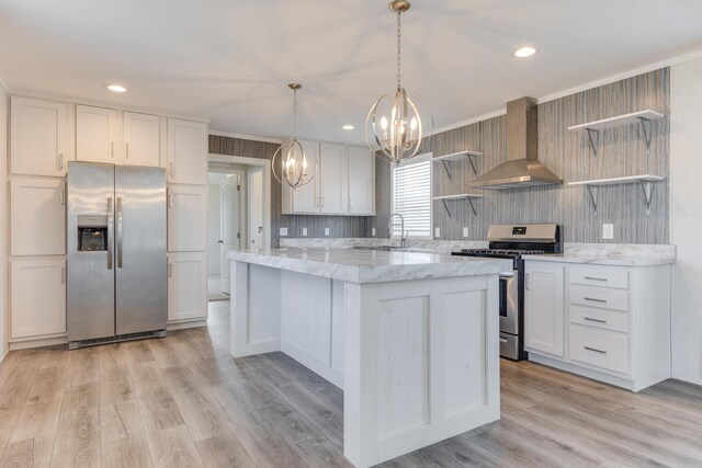 645 N Gallery Dr Unit 98, Eaton Rapids, MI 48827 - kitchen with stainless steel appliances, wall chimney exhaust hood, open shelves, a chandelier, and white cabinetry