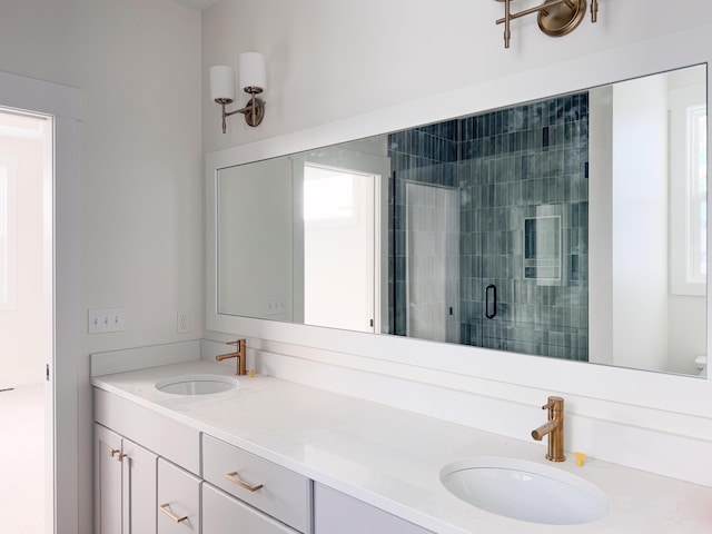 bathroom with an enclosed shower and vanity