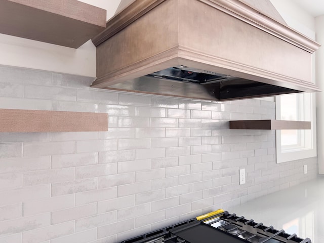 kitchen featuring custom exhaust hood and decorative backsplash