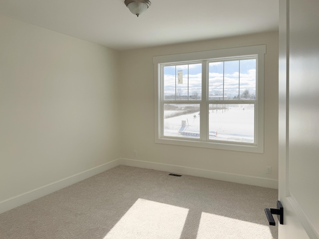 carpeted empty room with a water view