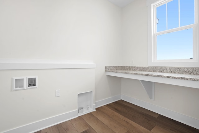 clothes washing area featuring dark wood-style flooring, baseboards, and hookup for a washing machine