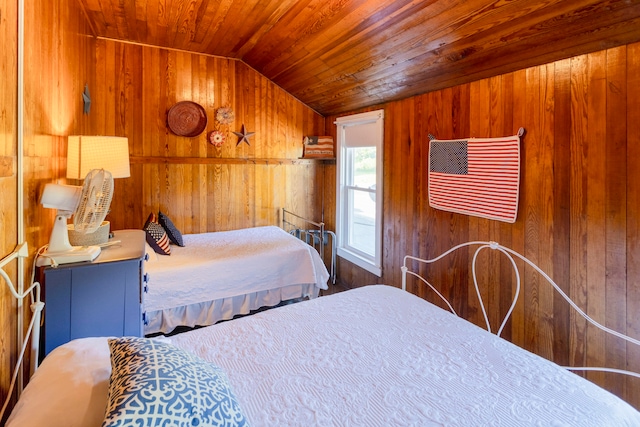 bedroom with wood walls, wood ceiling, and vaulted ceiling