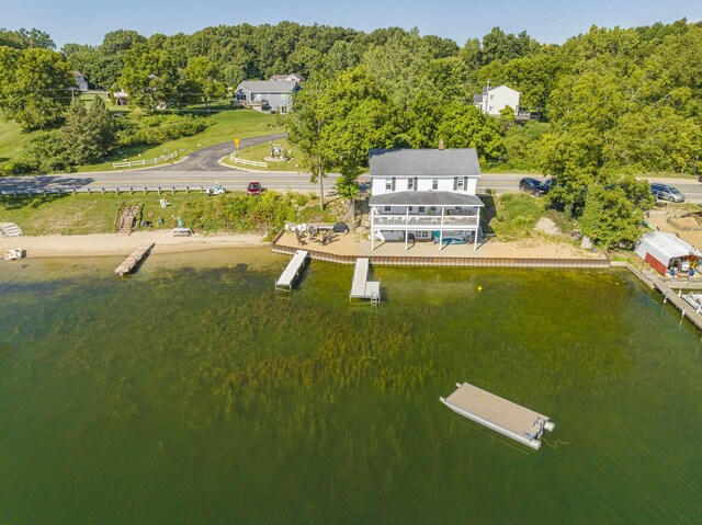 976 Doster Rd, Plainwell, MI 49080 - view from above of property with a nearby body of water and a heavily wooded area