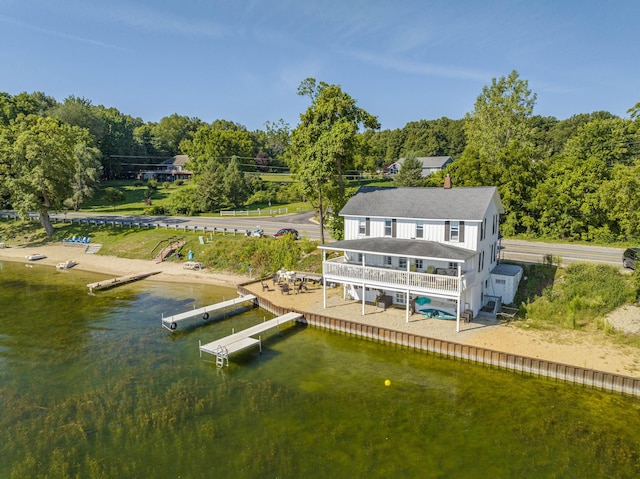 976 Doster Rd, Plainwell, MI 49080 - back of house with a forest view and a deck with water view