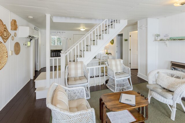 976 Doster Rd, Plainwell, MI 49080 - living area with stairs, hardwood / wood-style flooring, and an AC wall unit