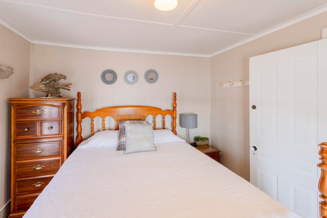 bedroom with crown molding