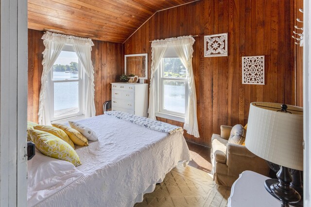 976 Doster Rd, Plainwell, MI 49080 - bedroom with multiple windows, wood walls, vaulted ceiling, and wooden ceiling