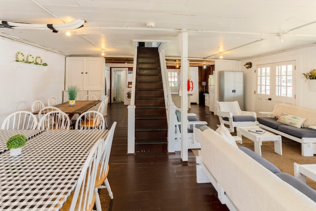 dining space with washer / dryer and dark hardwood / wood-style floors