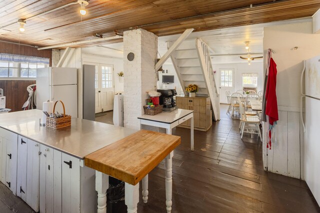 976 Doster Rd, Plainwell, MI 49080 - kitchen with freestanding refrigerator, wood ceiling, healthy amount of natural light, and dark wood-type flooring
