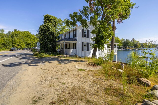 976 Doster Rd, Plainwell, MI 49080 - view of front of property featuring a water view and board and batten siding