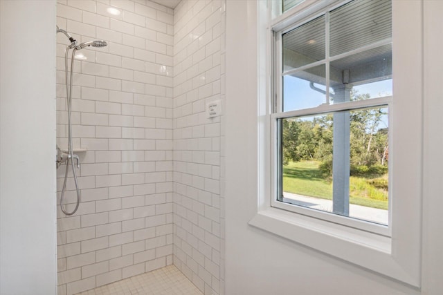 full bath featuring tiled shower