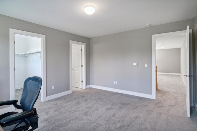 carpeted office with baseboards