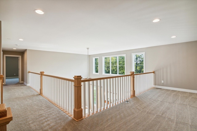 hall with baseboards, carpet flooring, and recessed lighting